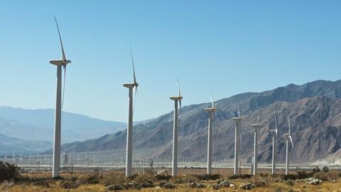 windmills in a row by Jeremy Heminger